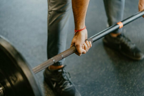 man lifting weights